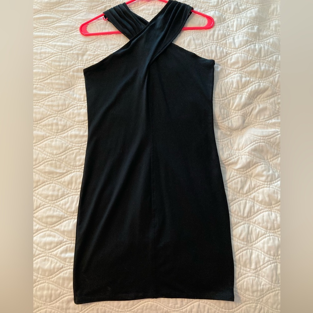 Women’s black dress. Size medium. Bodycon. Worn one time, very cute neckline!